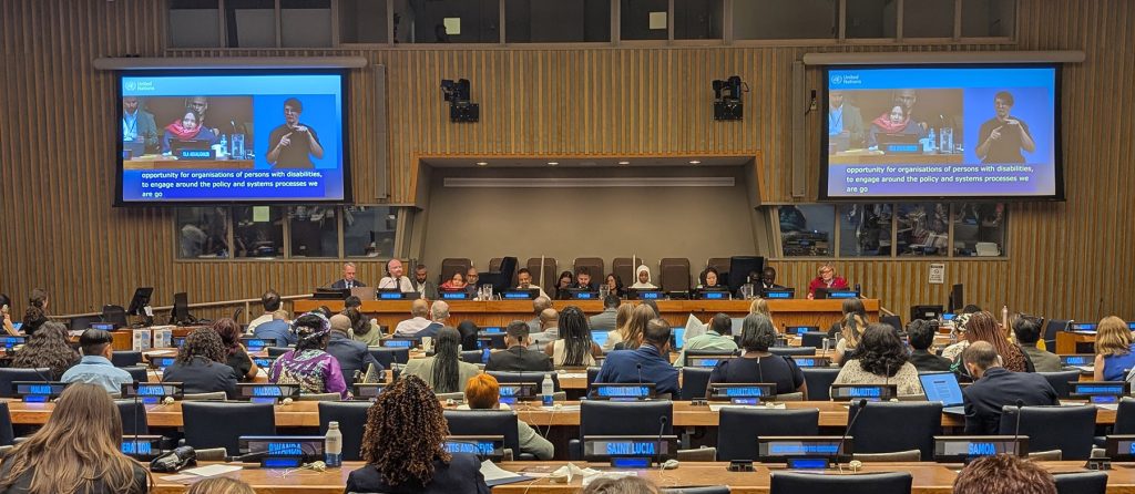 UN conference room with two large screens
